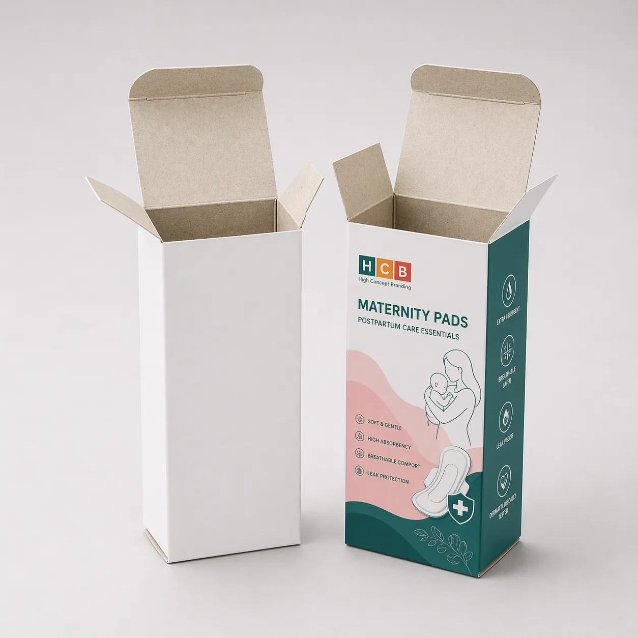 A white retail box standing beside a pink floral branded box for soft maternity pads. class=